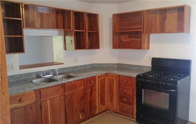 These open-faced custom cherry cabinets showcase t