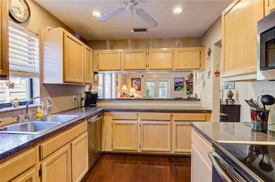 Kitchen from Garage door. Stainless Appliances