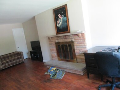 Liv.rm. wood floor and Fireplace