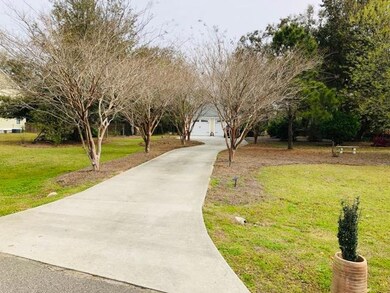 driveway to home and 2 car garage