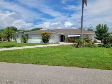 Ranch-style home with a front lawn and a garage