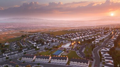 Aerial overview of property's location with mountains and nearby suburban area