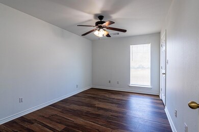 Unfurnished room featuring dark wood-type flooring