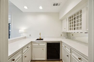 Wet bar with sink and wine rack. Great for enterta
