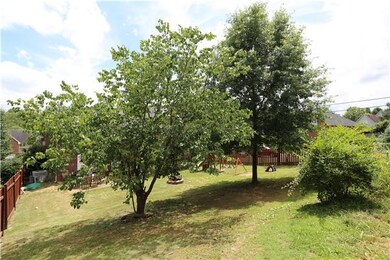 Nice back yard with trees and fencing