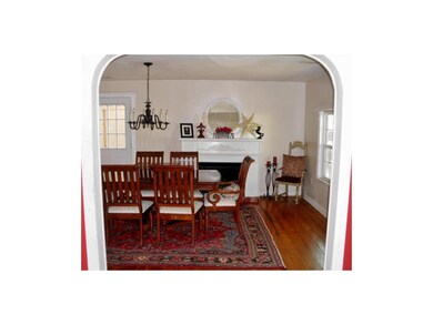 Unique arched doorway, leading into the dining roo