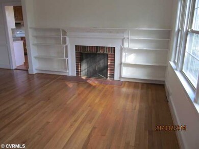 Living Room - Very inviting living room with custom built bookcases, fireplace and lovely hardwood floors