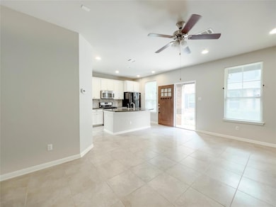 Unfurnished living room featuring recessed lighti