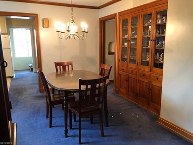 A beautiful dining room with a unique china cabine