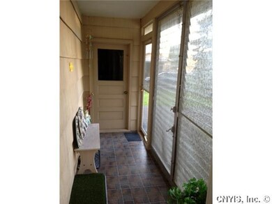 Exterior Front. Enclosed front porch. Door takes y