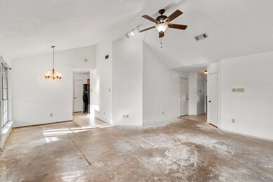 Living - note the vaulted ceilings. Front entry to