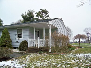 Private, covered back porch off kitchen is the per