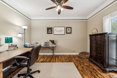 Office converted from formal living room with sliding barn doors