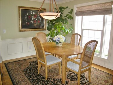Formal dining room with crown molding, chair rail,