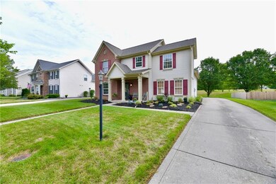Extended Driveway with Attached Garage and extra parking in the back