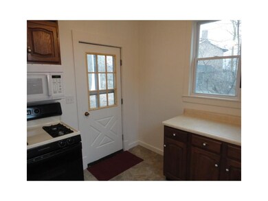 Kitchen. Kitchen area features door to small rear 