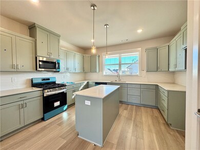 The quartz countertops, walk-in pantry, and stainless steel appliances provide the perfect combination of style and functionality for a modern and efficient living experience.
