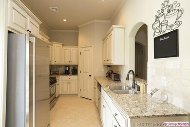 Kitchen has granite counter tops and painted and g