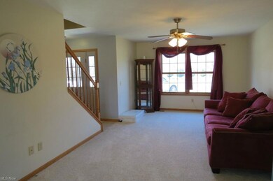The living room sits off the foyer and the dining 