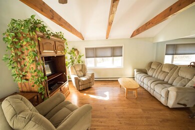 Bright airy living room with vaulted ceilings open
