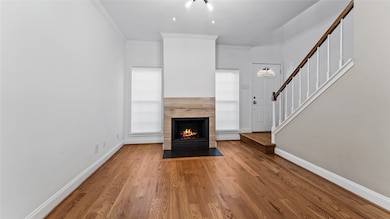 Fireplace anchors this charming space.