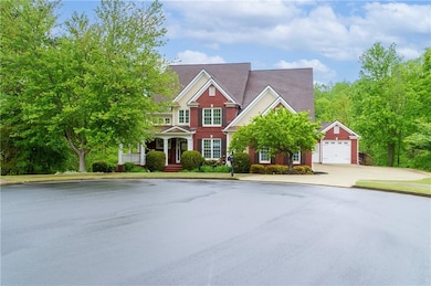 View of front of property with a garage and concre