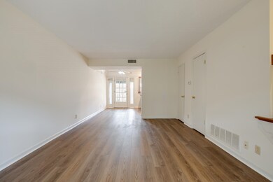 Empty room featuring wood finished floors and ceiling fan