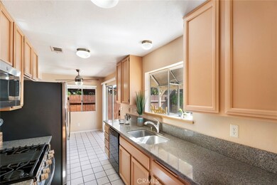 Kitchen with Ample Cabinet Space & Bay Window