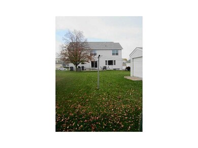 Exterior Back. Nice lawn with a garden and some ma