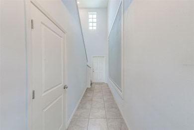 Entry hall facing front door.