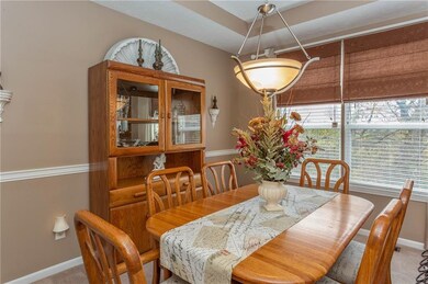 Look up, Dining Room has tray ceiling and one of many new light fixtures in this home.