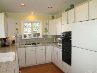 Updated kitchen with tiled counter tops recessed l