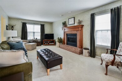 Family room with gas fireplace and newer glass doo