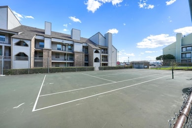 View of tennis court with fence
