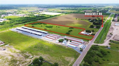 Aerial view of property's location featuring industrial structures and property parcel outlined