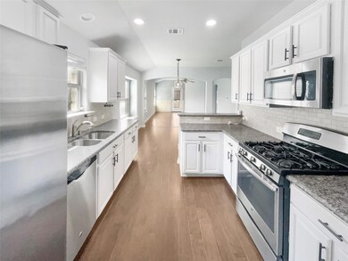 Kitchen featuring stainless steel appliances, a s