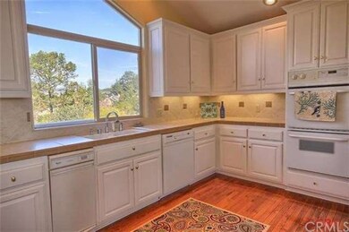 Kitchen features double oven, decorative tile and 