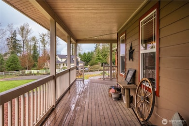 Expansive covered front deck invites your to sit and enjoy the views.
