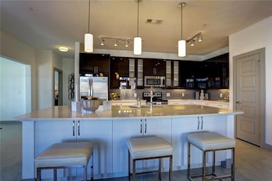 Kitchen with hardwood / wood-style flooring, a bre