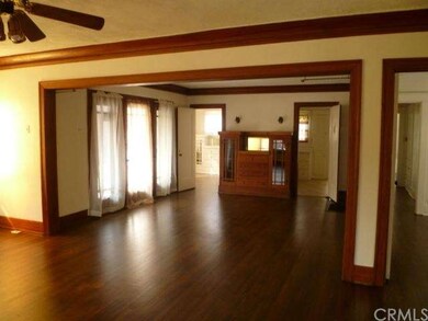 Original 1923 moldings and hardwood flooring grace