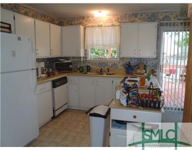 Kitchen. The kitchen is just big enough and fully 