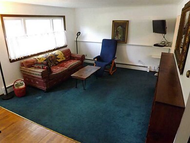 Living Room. Living room has hardwood floors benea