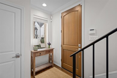 Nice-sized windowed foyer and deluxe two-paneled f