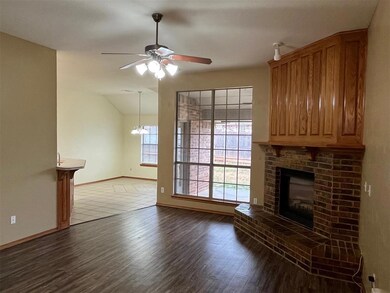 Unfurnished living room with vaulted ceiling, dark