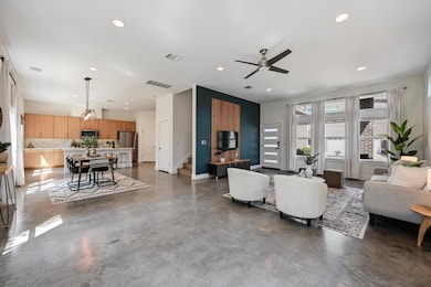 Living area with recessed lighting, visible vents