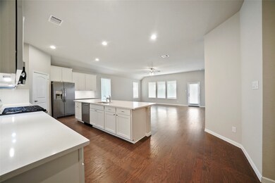 The home also features a great open floor plan with tons of natural light and canned recessed lighting.