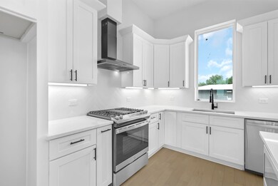 Kitchen with Appliances and Cabinet Underlighting