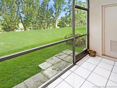 Screened patio with extra storage closet