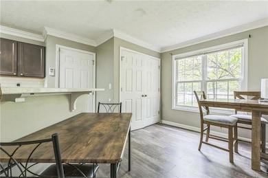 Office area featuring ornamental molding, a textur