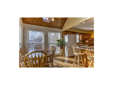Spacious dining room is flooded with natural light